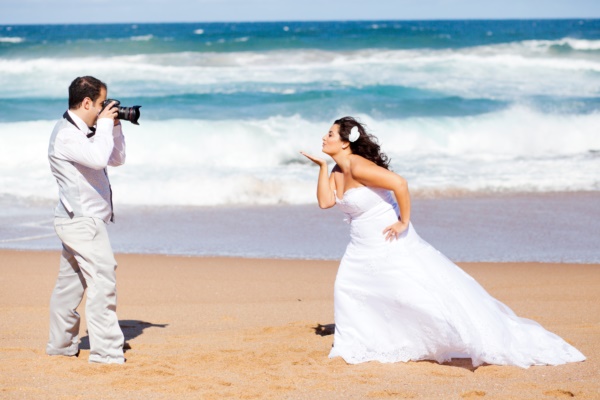 wedding photo shoot - groom taking bride's photo