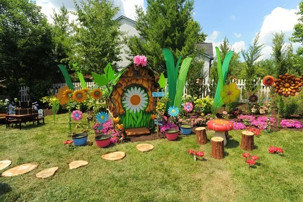 A rusty chain link fence was removed from homeowners Graham and Marcy Galloway's back yard. In it's place popped up a colorful Pixie Hollow inspired play area in one side. As seen on HGTV's My Yard Goes Disney. After #10