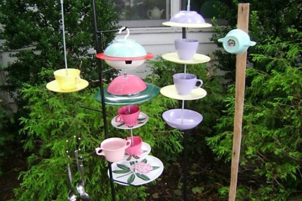 Gerri Kopp uses plastic plates and cups to make wind chimes, bird houses  and birdfeeders.